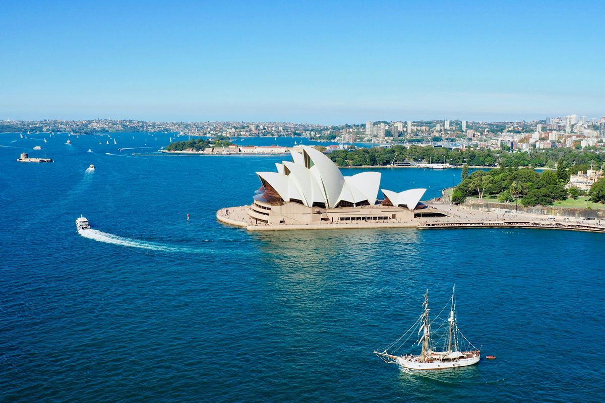 The Sydney Opera House on the blue waters of the harbour